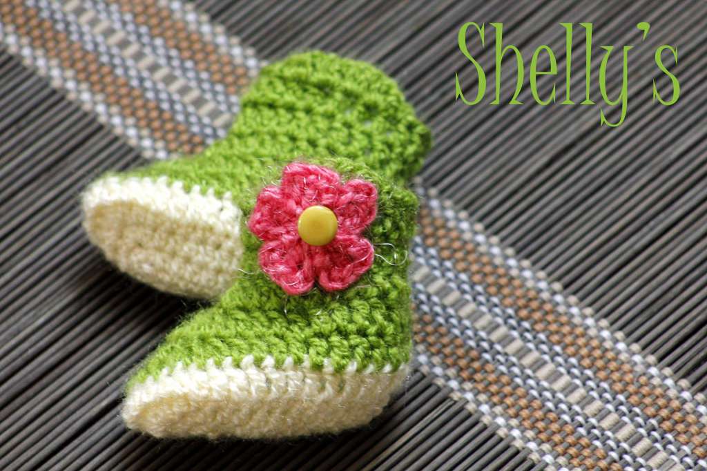 Crochet boots with pink flower 